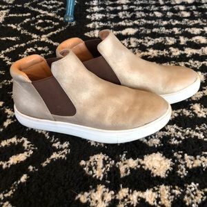Muted gold ankle high slip on casual sneaker